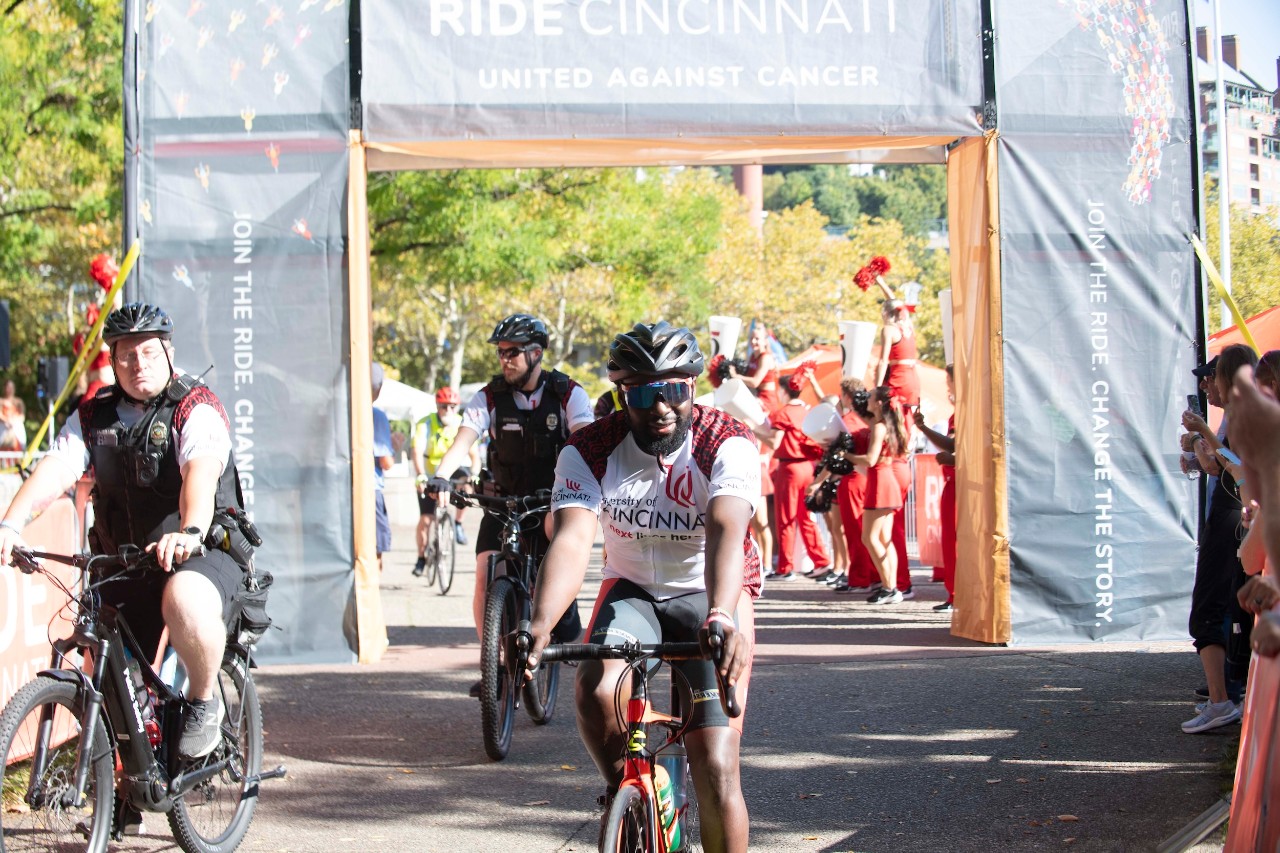 A UC Rider coming through the finish line
