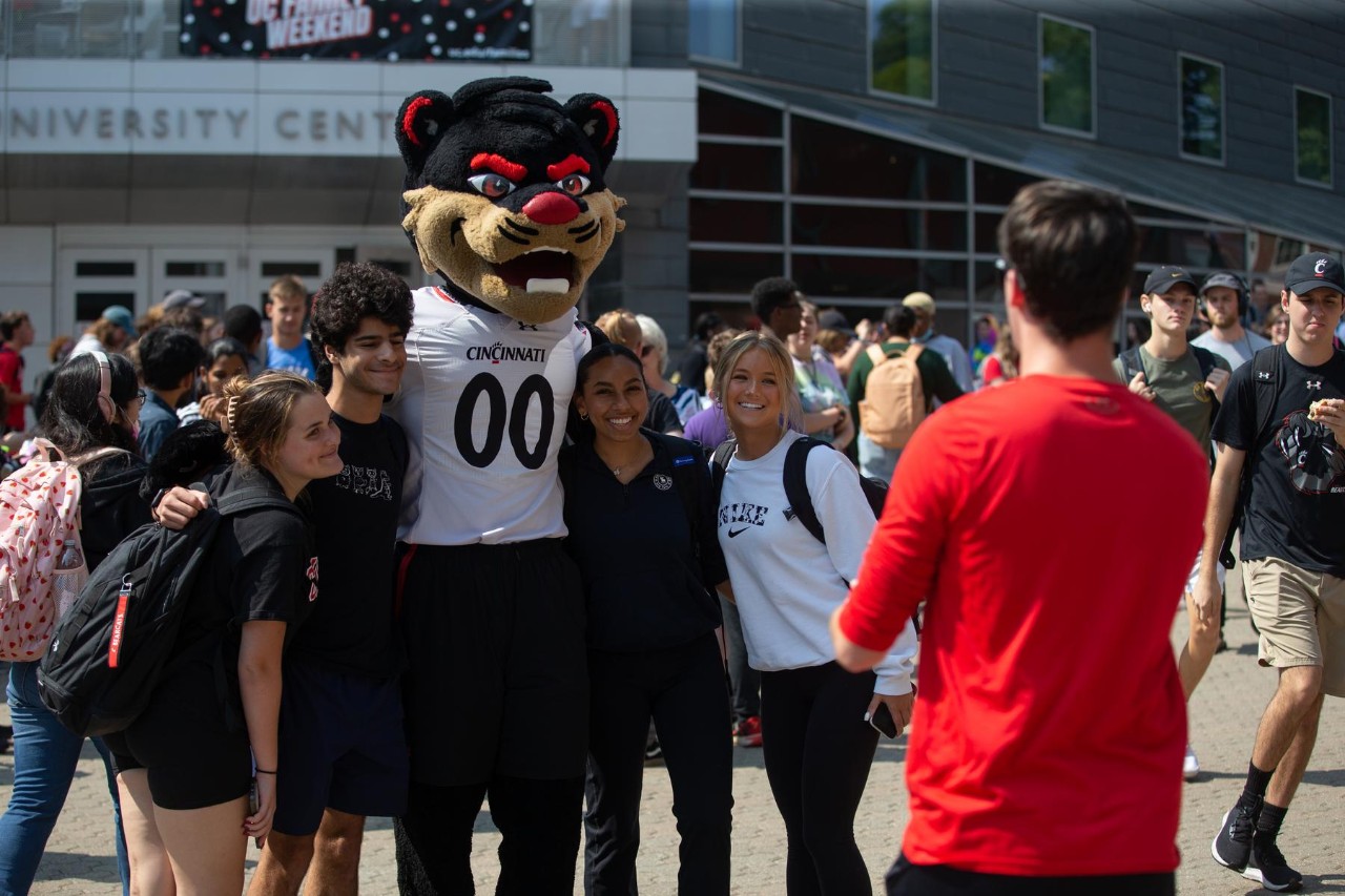 Family Weekend events around campus. The marching band performs at a pep rally on Main Street.